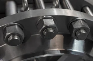 Close-up of a bolted pipe flange used in a seawater system